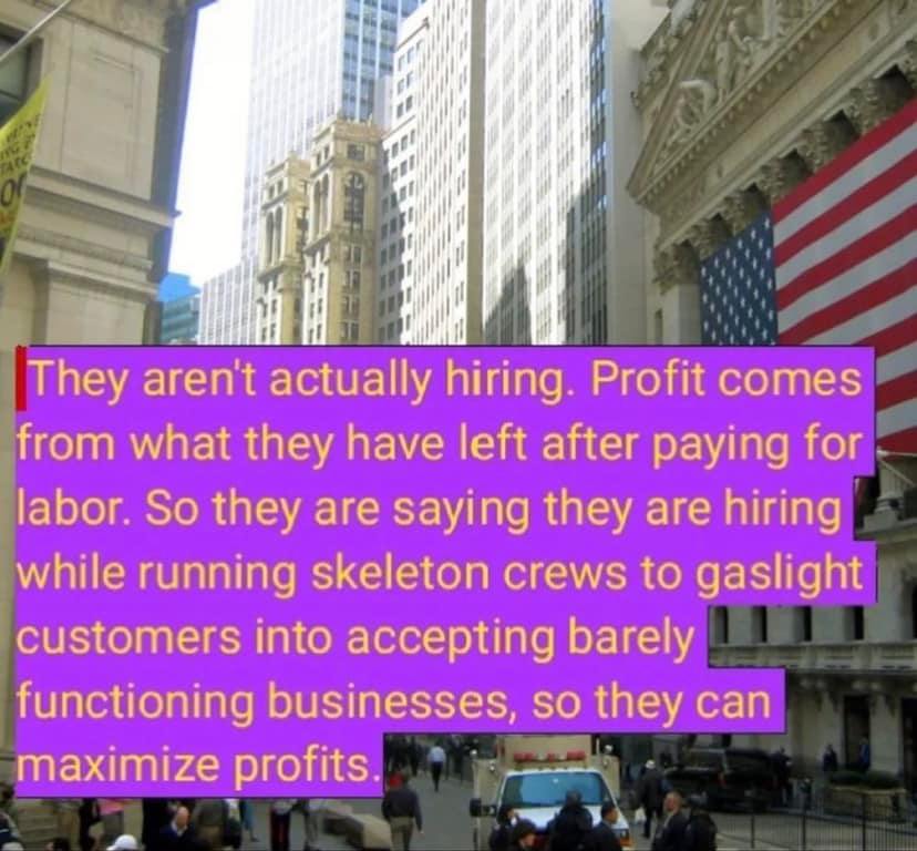 This meme is a humorous commentary on the struggles of modern employment. The image depicts a city street with a large, bolded text overlay that reads: "They're not employees, they're freelancers. They're not employees, they're contractors. They're not employees, they're temps. They're not employees, they're interns. They're not employees, they're volunteers. They're not employees, they're customers. They're not employees, they're clients. They're not employees, they're...". The text is a satirical commentary on the erosion of worker rights and the exploitation of labor in modern capitalism.